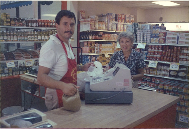 Kenny at the cash register